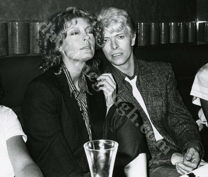 Susan Sarandon, David Bowie   1983 NYC cliff AC.jpg